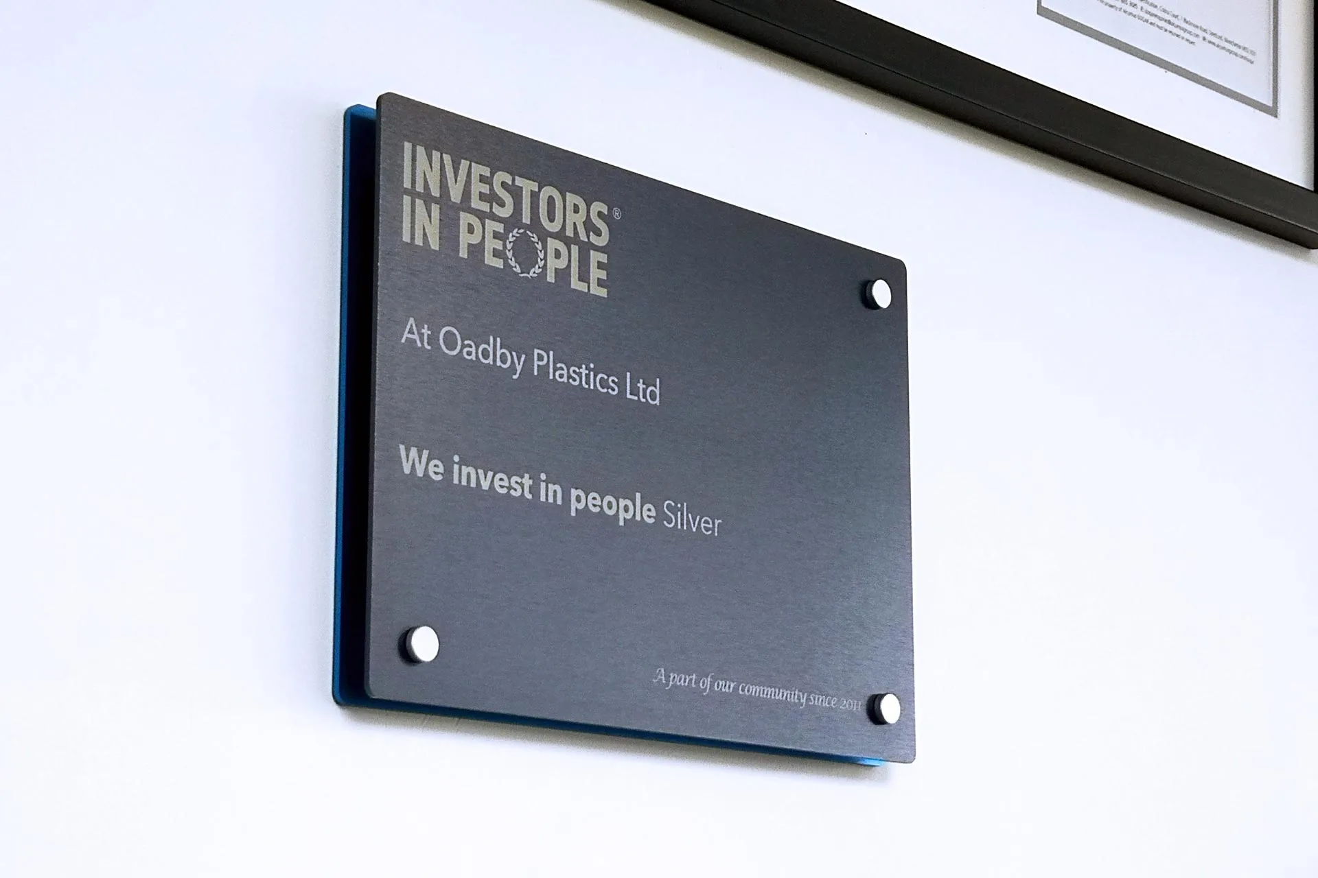 Investors in People Silver plaque on the wall at Oadby Plastics