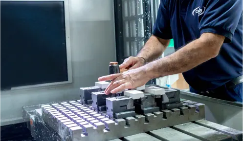 Close up of a machine operator at a CNC mill machine at Oadby Plastics