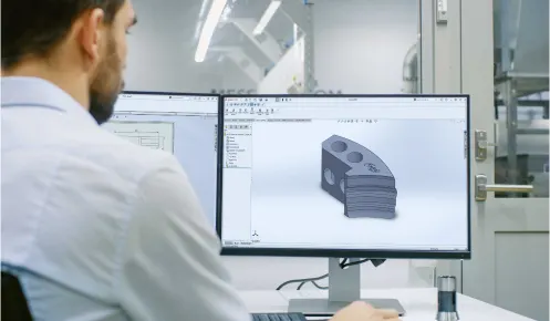 Oadby Plastics Technical Team working with a 3D technical drawing of an engineering plastics component from reverse engineering and CNC machining preparation