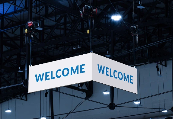 A welcome sign at an exhibition made from plastic foam