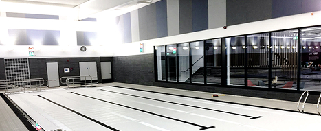 Swimming pool retractable floor made from a durable plastic that is chemically resistant