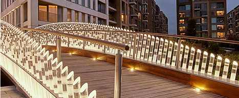 A custom made bridge in Chelsea, London, commissioned to Oadby Plastics Group showcasing clear plastic tubes with LED lights shining through at night