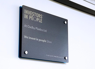 Investor in people silver award on the wall at Oadby Plastics