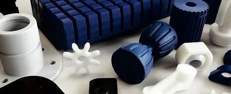 A range of CNC milled parts arranged on a table