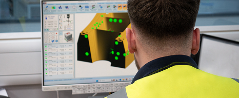 Close up of someone doing QA and reverse engineering with a product on screen