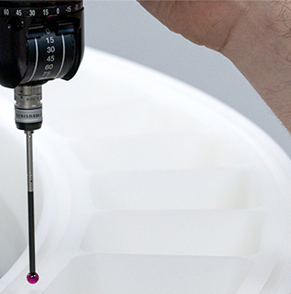 A close up of engineered plastics being QA'ed at Oadby Plastics