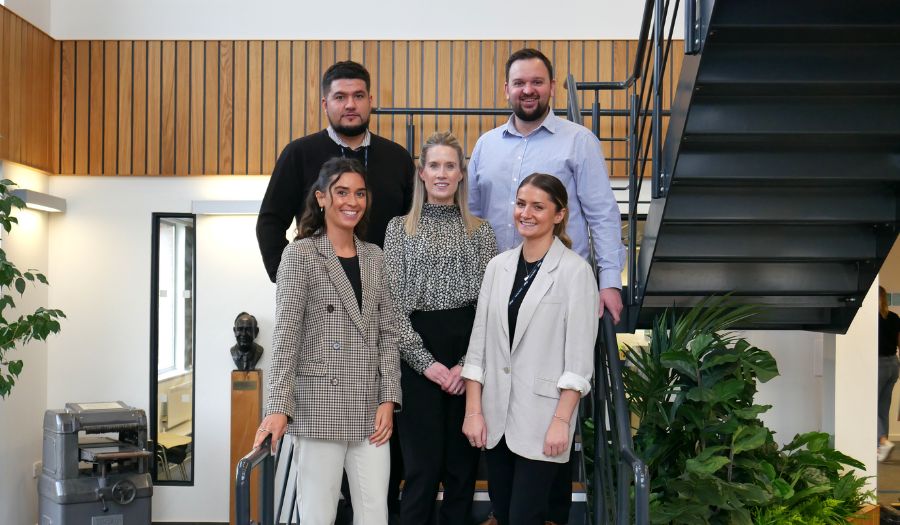 The Business Development team on the stairs at Oadby Plastics Head Office in Leicester welcoming new customers