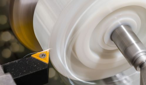 close up of a CNC turning machine with plastic component
