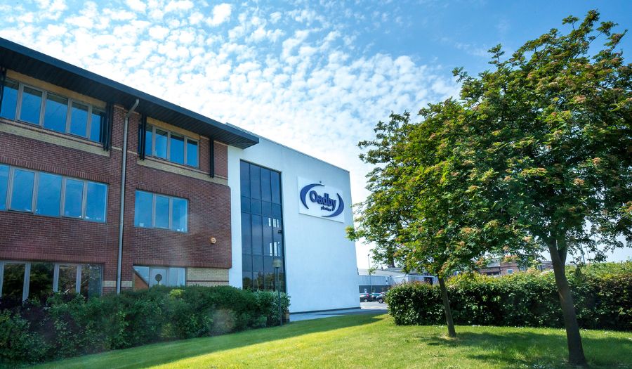 Oadby Plastics Head office with green tree and grass