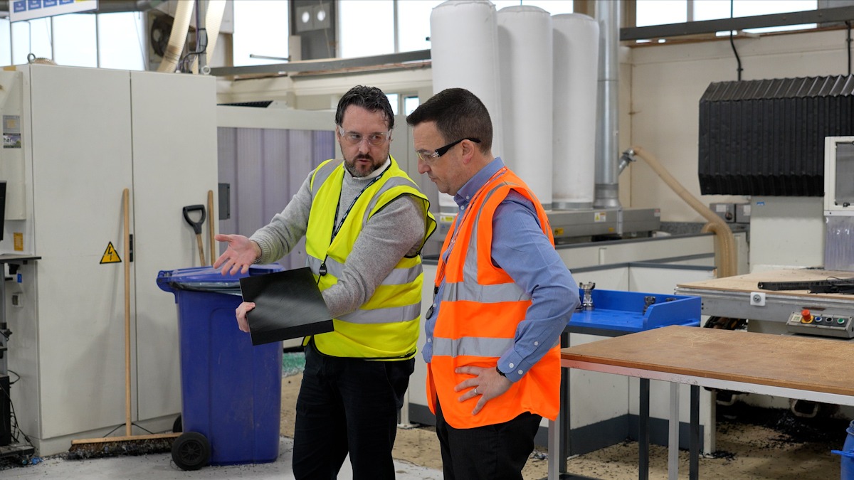 Sam and Kev viewing materials used in the production of customer orders